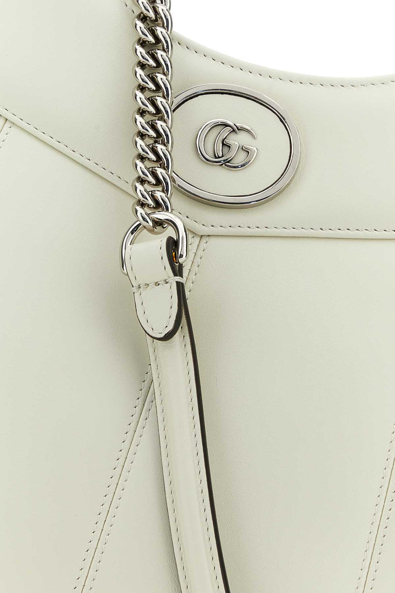 Gucci Leather Gg Medallion Top Handle Bag — Beige